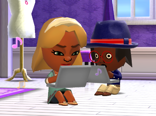 Jill and Lottie using laptops, with Lottie looking shocked