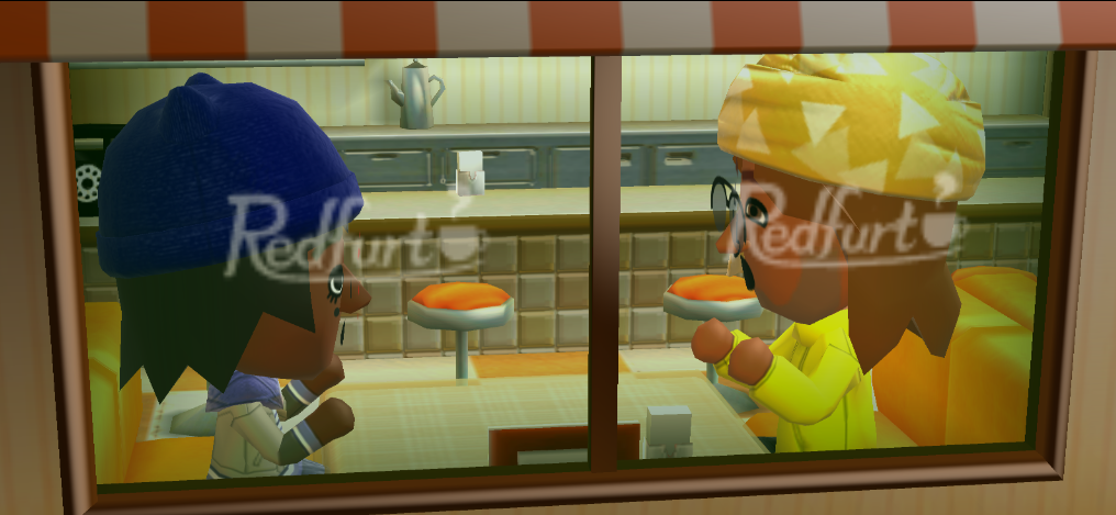 Lottie and Adrian chatting in a cafe