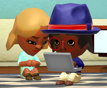 Lottie typing on a laptop while Jill watches