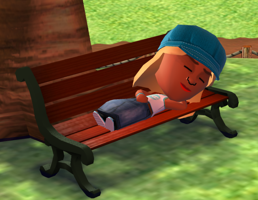 Jill sleeping on a bench in the park