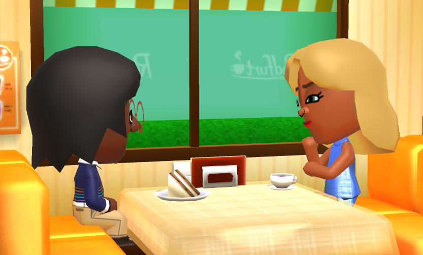 Lottie and Jill sitting across from each other at a cafe