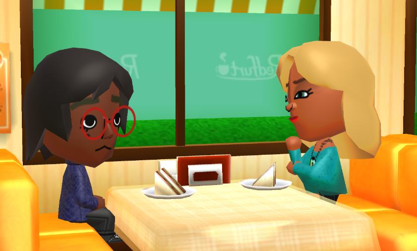 Lottie and Jill talking at a cafe