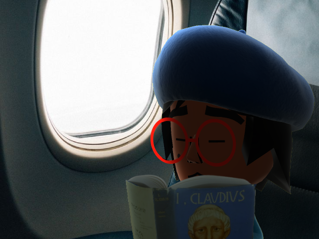 Lottie reading I, Claudius on a plane