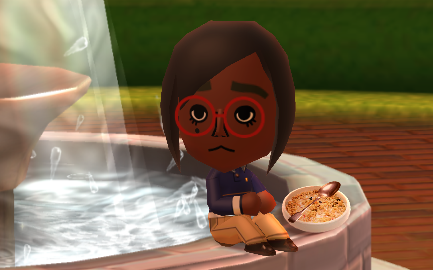 Lottie sitting on the edge of the fountain with a bowl of oatmeal and a spoon