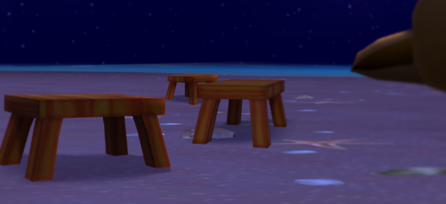 Shot of stools on the beach and the carcass in the background